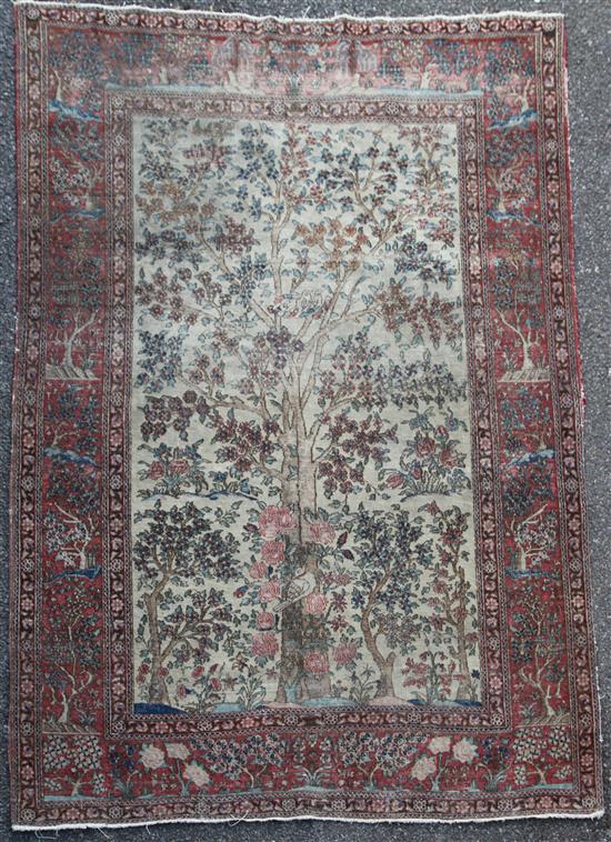 An antique Kerman Tree of Life rug, 6ft 3in by 4ft 4in.